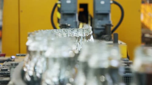 Glass Bottles on Conveyor Belt in Factory
