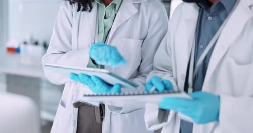 Scientists Analyzing Data in Modern Laboratory