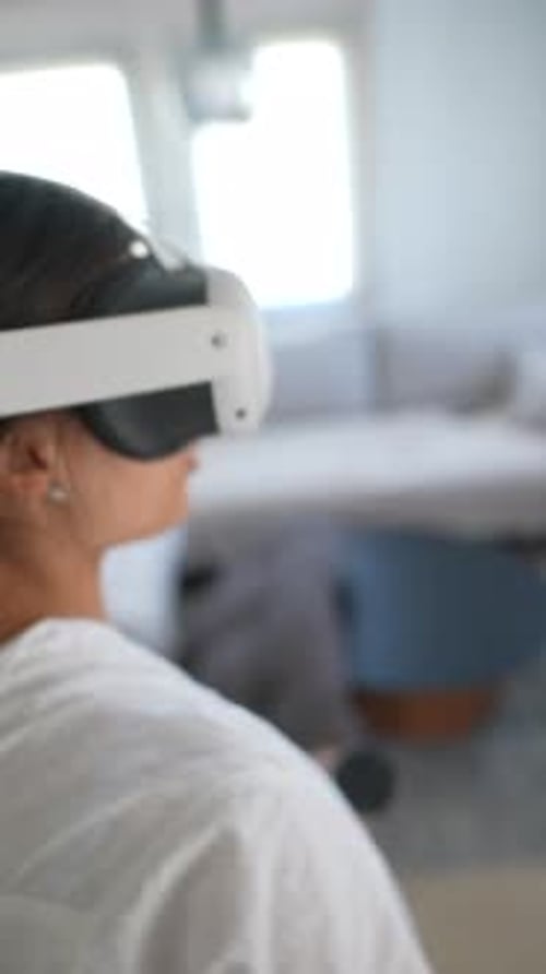 Woman Immersed in Virtual Reality at Home