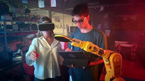 Young Adults Controlling Robot Arm With VR Technology