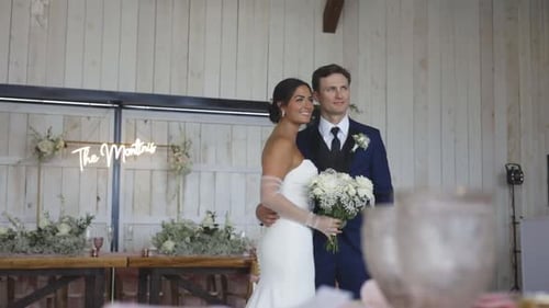 Elegant Couple Embraces at Wedding Reception