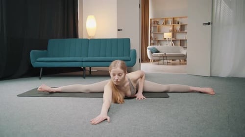 Woman Doing Yoga Stretching Exercise at Home