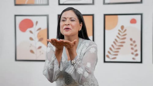 Woman Blowing Kisses to the Camera