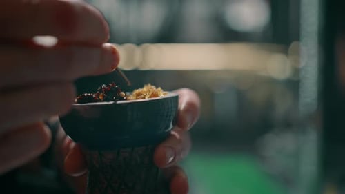 Hands Preparing a Hookah Bowl