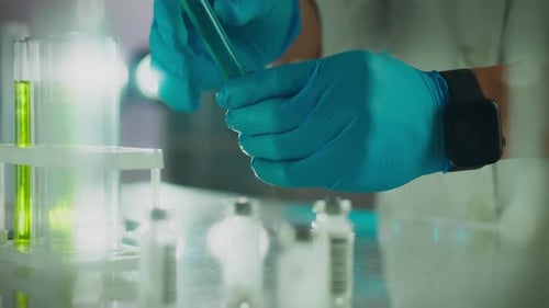 Scientific. A researcher analyzes the composition of liquids in his office. Smooth motion