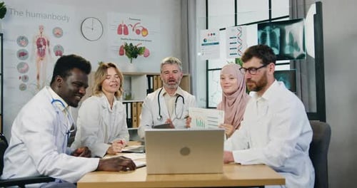 Medical Team Meeting in Modern Office