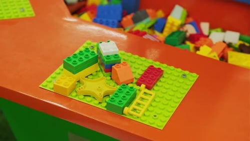 Colorful Building Blocks Laid Out for Creative Play in a Cheerful Indoor Play Area Filled with