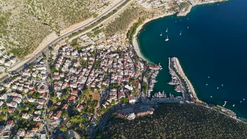 Aerial View of Coastal Town with Harbour, Turquoise Sea