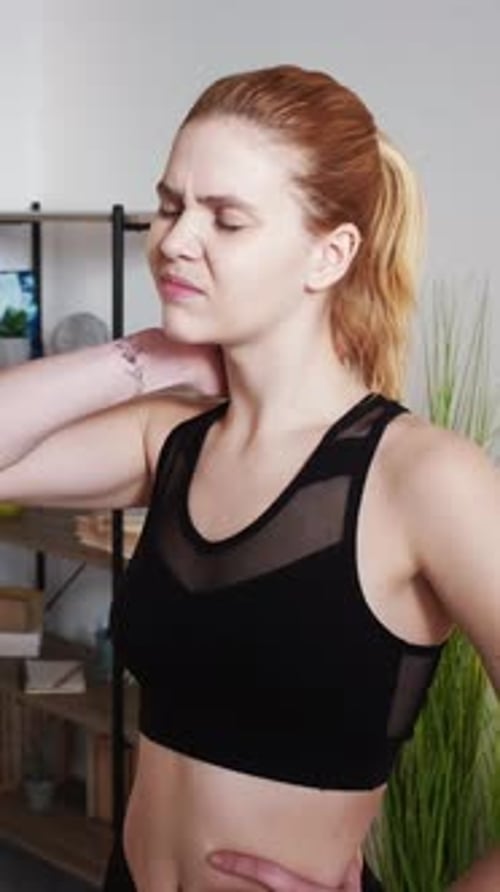 Woman Stretching Neck at Home, Portrait Video