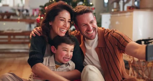 Happy Family Taking Christmas Selfie in Cozy Home