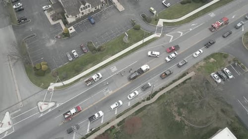 police and firefighters help cleanup road after auto accident