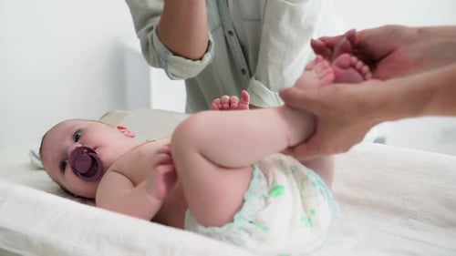 Baby Leg Stretching Exercise on Changing Table