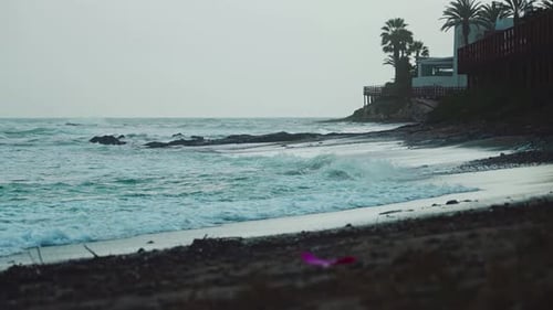 Ocean waves at an empty beach during a cold day