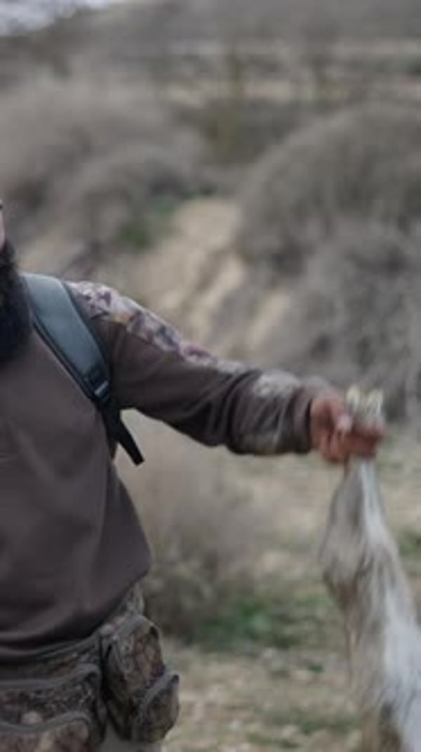 Man with Rifle Holds Rabbit After Hunt, Nature Stock Footage ft. hunter ...