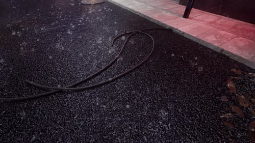 Wet Urban Street At Night And Scattered Cables 4K