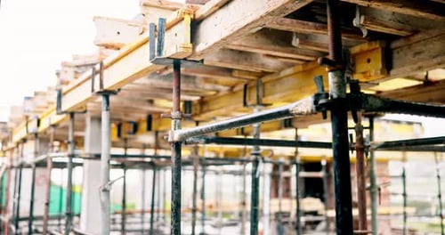Beam, construction and empty site with scaffolding for building, renovation or structure support