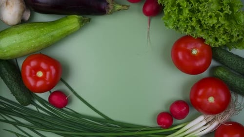 Fresh Vegetables on a Green Background with a Place to Insert Text Stop Motion Animation
