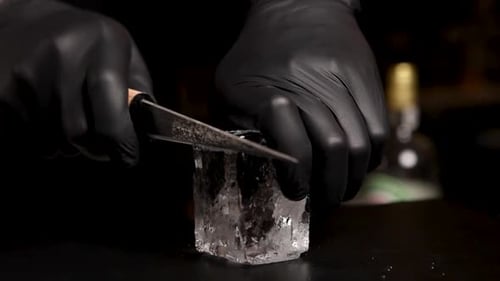 the bartender prepares a cocktail at the bar