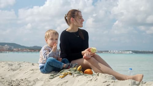 Mother and her son enjoy a day at beach