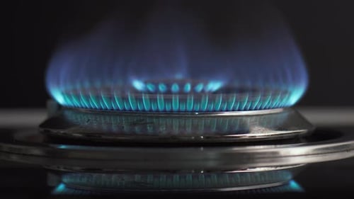 Gas stove is turned on. Closeup view of burning flame