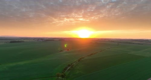 Aerial View of Green Fields During Brilliant Sunrise
