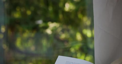 Open Book on Window Sill with Green View