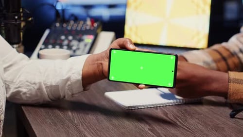 Guest Reacting to Videos on Mockup Smartphone During Online Comedy Show