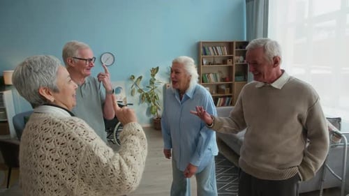 Seniors Chatting and Laughing in Nursing Home