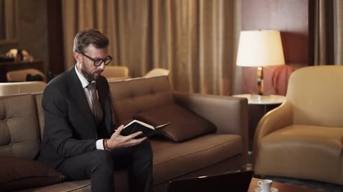 Business Meeting in the Hotel Room Man in a Suit a Businessman Shaking Hands with a Woman Colleague