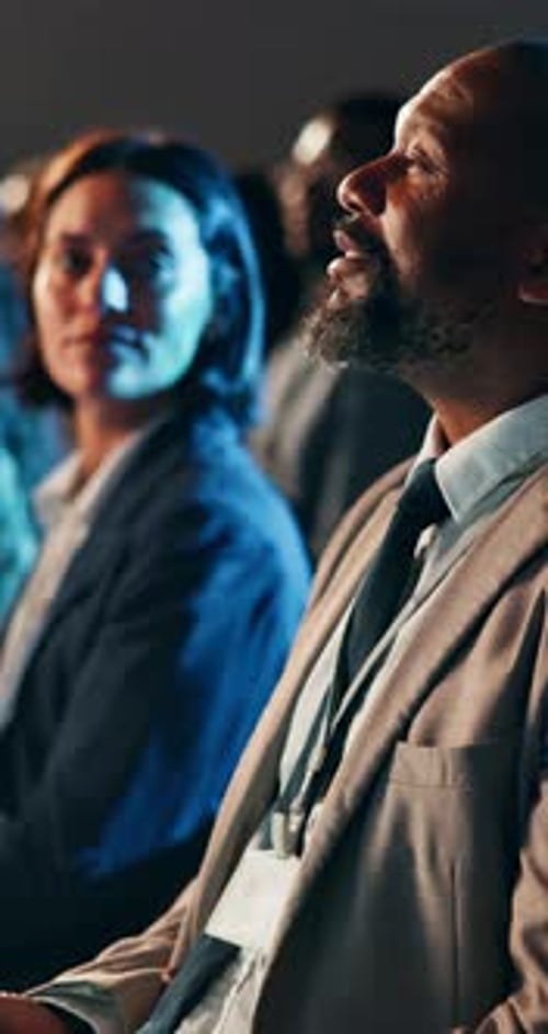 Adults Attending a Conference in Business Attire