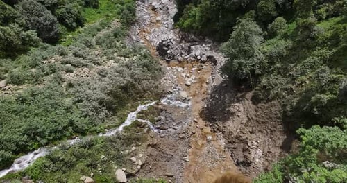 Aerial view of flooding in Sindhupalchowk, Nepal, amidst dense green forests and beautiful landscape