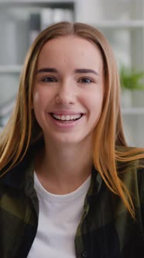 Smiling teen girl with braces portrait indoors