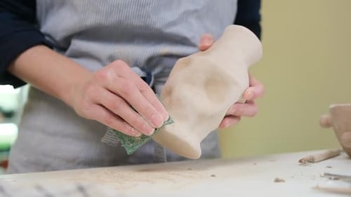 Woman Sculpts Vase From Clay By Hands Closeup in Artistic Studio