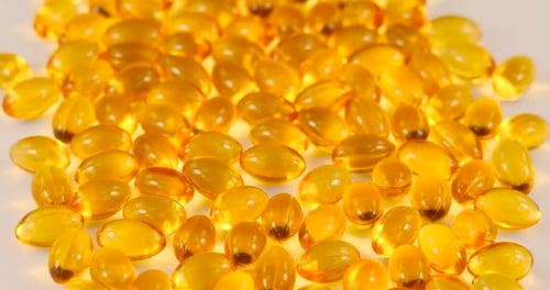 Golden Vitamin Gel Capsules Close Up