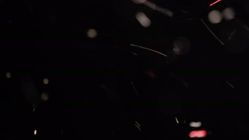 Abstract Floating Light Particles on Black Background