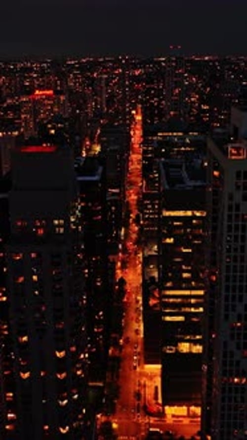 Cityscape view of Chicago at night with illuminated streets