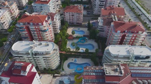 Vertical Video Aerial View of a Luxury Pool with Azure Water in a Stylish Housing Complex