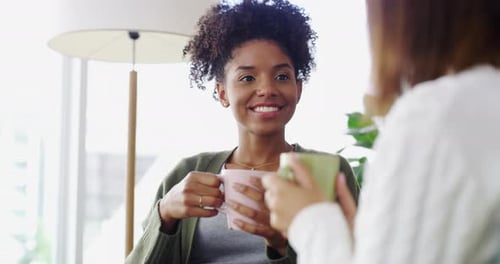 Friends Chatting and Laughing with Coffee Mugs