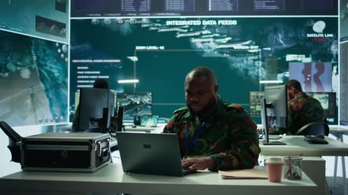 People Working in a Futuristic Military Control Center