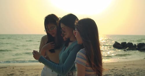 Group of women friends posing reaction taking photos at sea beach enjoy life