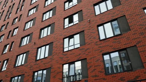 New modern sleeping area with high rise buildings. Stock footage. New bright house wall in a quarter