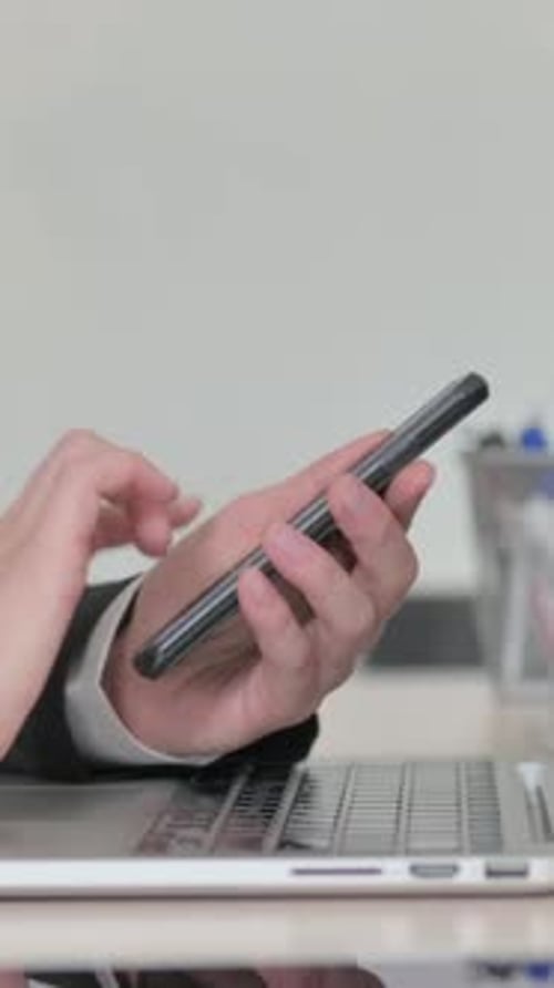 Young Businesswoman Using Smartphone, Close Up, Vertical Video