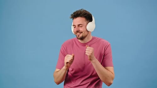 Man Dancing to Music with Headphones On