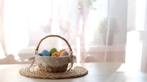 Easter Colorful Eggs in Busket on White Wooden Table