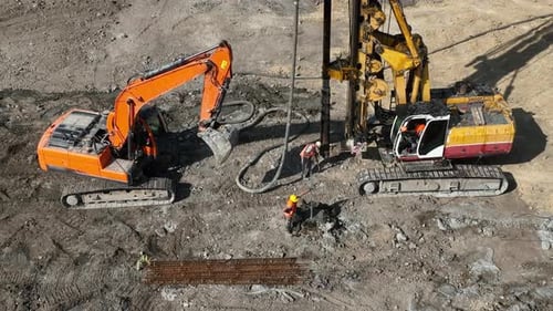 Construction Workers Operating Heavy Equipment at a Job Site An Aerial View of a Construction Site