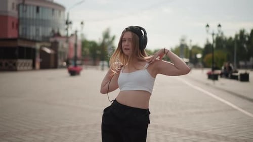 Female Dancer in City Square Carefree Young Woman Spinning Through Town Casual Street Performance