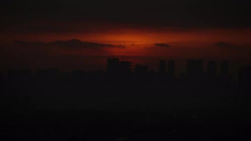 Manila Skyline Against Burning Sky