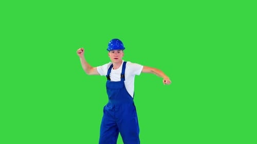 Happy and Excited Construction Worker Dancing on a Green Screen Chroma Key