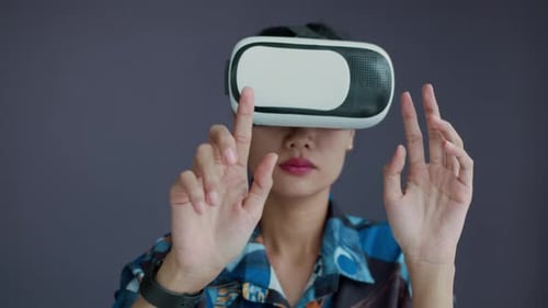 Young Woman Wearing VR Headset Isolated on Copy Space Background