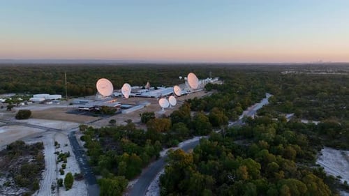 Aerial View of Radio Telescope Station at Sunrise